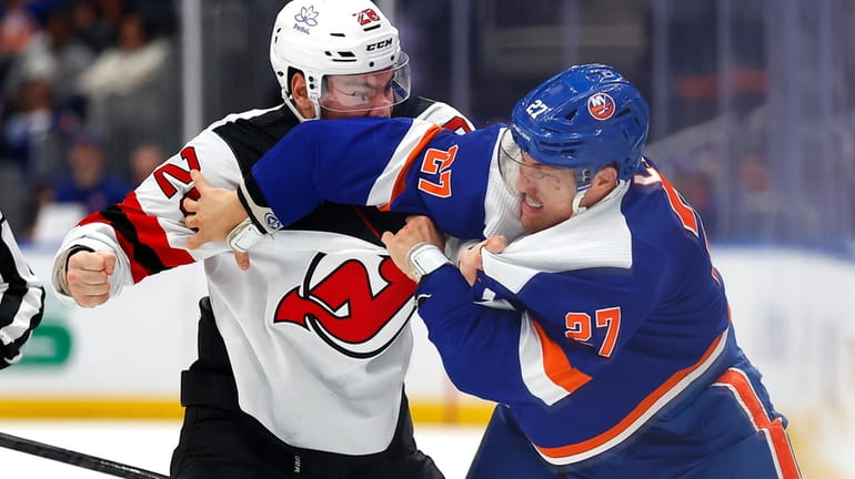 Islanders left wing Anders Lee and New Jersey Devils right...