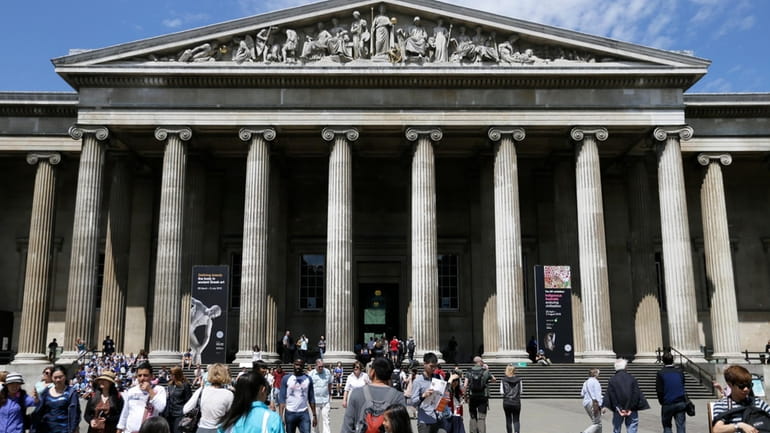 Visitors walk outside the British Museum in Bloomsbury, London, Friday,...