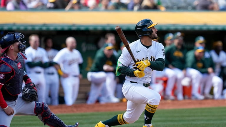 Oakland Athletics' Abraham Toro, right, watches his two-run single during...