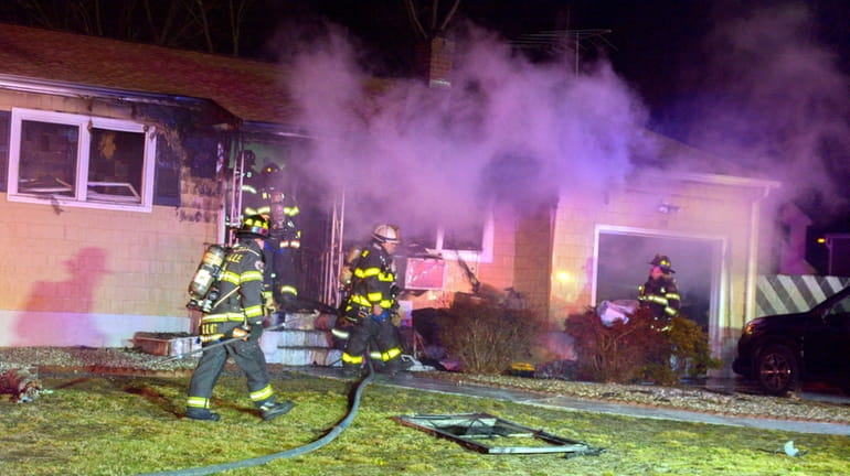 Holtsville Fire Department firefighters worked alongside multiple mutual aid departments...