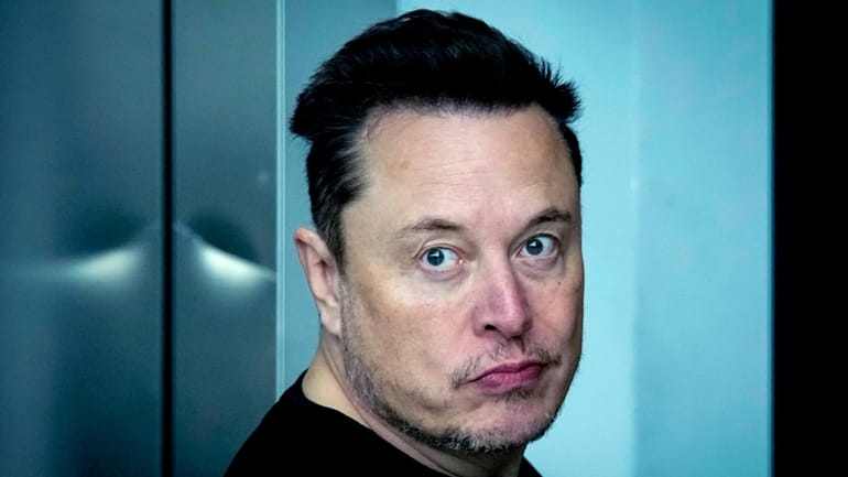 Tesla CEO Elon Musk leaves the Tesla Gigafactory for electric...