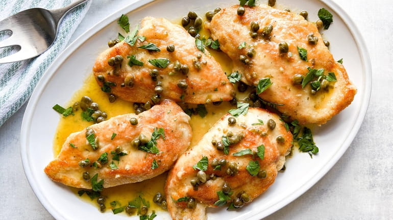 Chicken cooked with lemon, capers, parsley and butter.