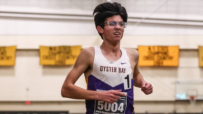 Christopher Tardugno of Oyster Bay wins the 3,200-meter run during...