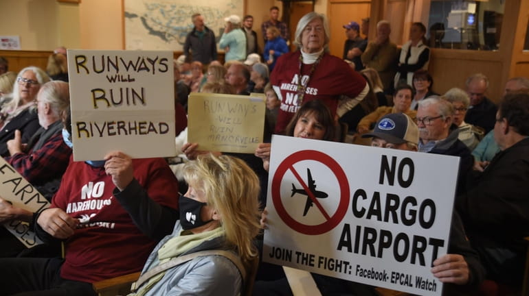 Community members oppose Calverton Aviation & Technology's plan to develop the former...