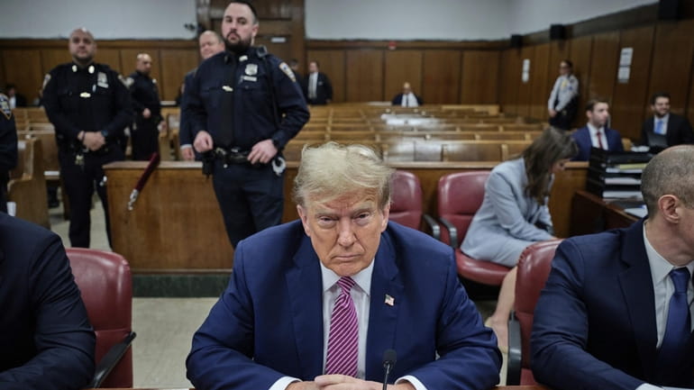 Former President Donald Trump appears for jury selection in his...