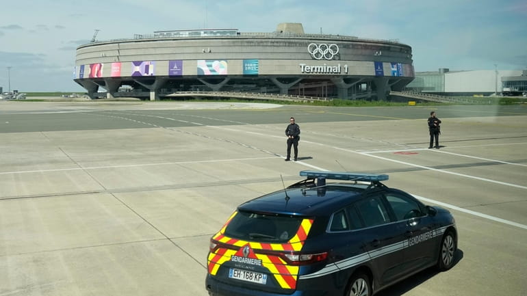 Gendarmes pose in front of the Charles de Gaulle airport,...