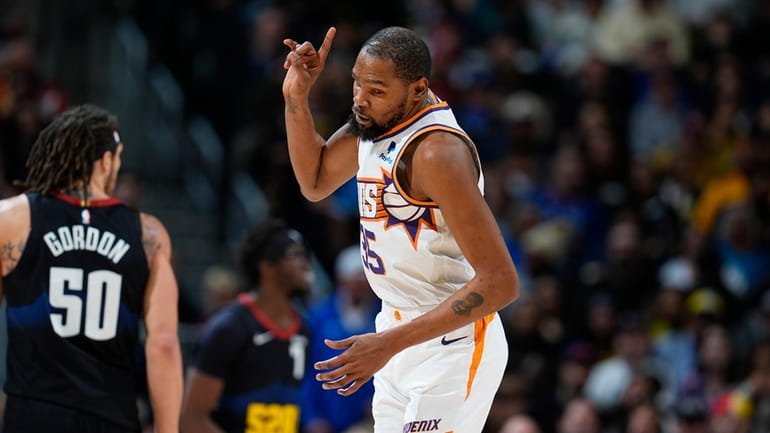 Phoenix Suns forward Kevin Durant gestures after hitting a 3-point...