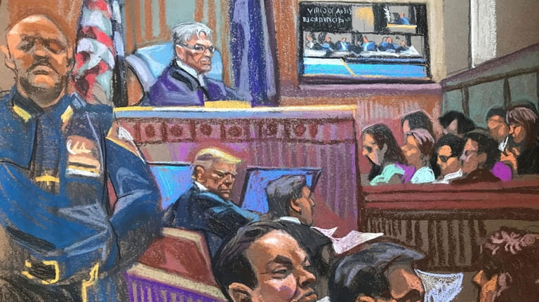 In this courtroom sketch, former President Donald Trump sits beside...