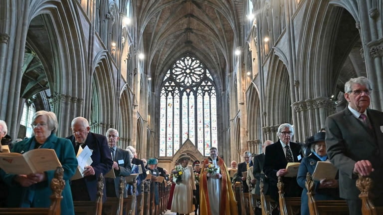Britain's Queen Camilla, left, and Interim Dean of Worcester Cathedral...
