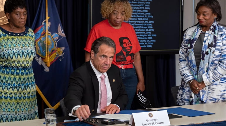 Gov. Andrew Cuomo signs a series of bills that will...