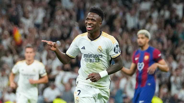 Real Madrid's Vinicius Junior celebrates after scoring his side's opening...