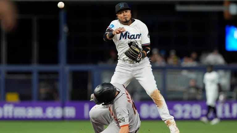 Miami Marlins second baseman Luis Arraez (3) attempts to complete...