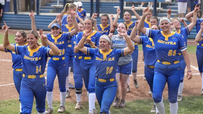 The Hofstra softball team gets the crowd going during the...