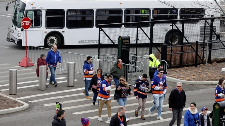 Fans attend a game between the New York Islanders and...