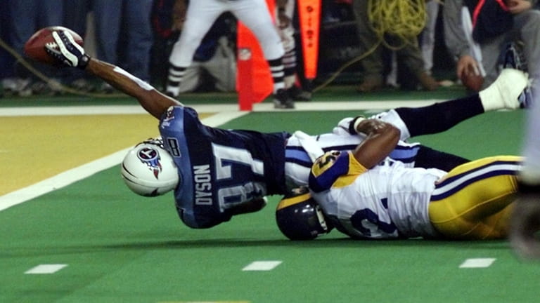 Titans wide receiver Kevin Dyson tries but fails to get...