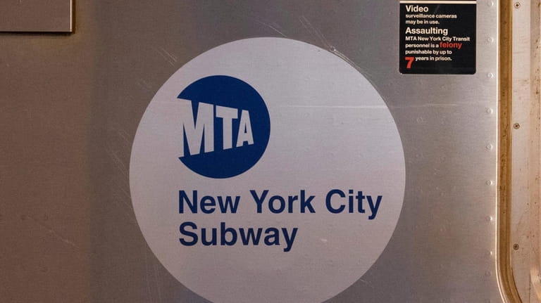 The MTA logo is seen on the side of a...