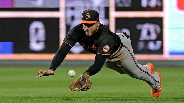 Baltimore Orioles right fielder Anthony Santander catches a ball for...