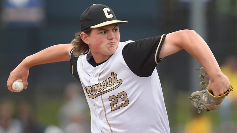 Evan Kay, Commack pitcher, delivers to the plate during the...