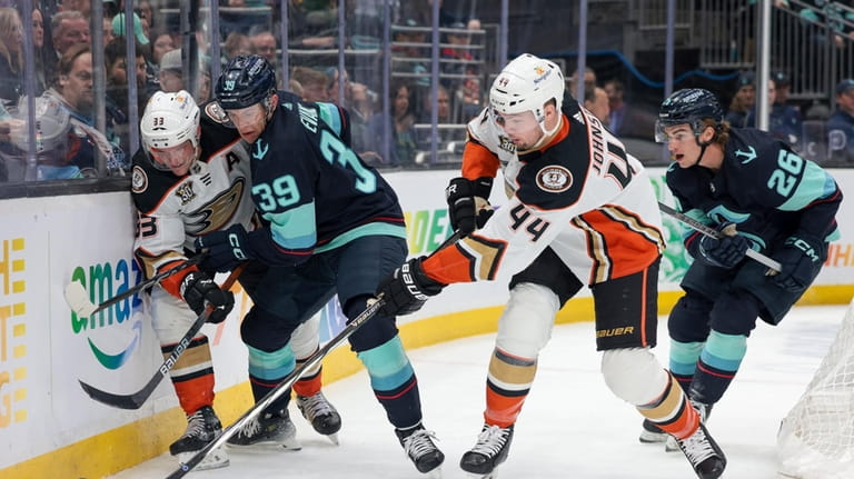 Anaheim Ducks left wing Ross Johnston (44) and right wing...