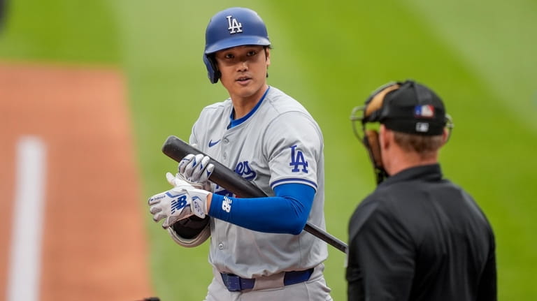 Los Angeles Dodgers designated hitter Shohei Ohtani prepares to bat...