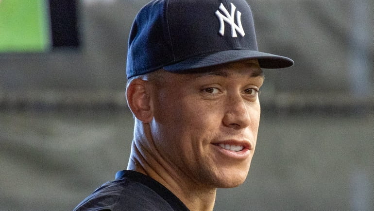 The Yankees’ Aaron Judge looks on during spring training at...