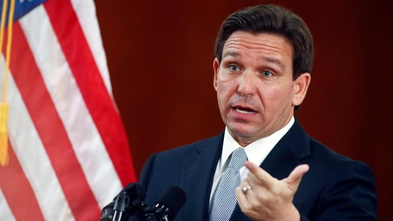 Florida Gov. Ron DeSantis answers questions from the media, March...