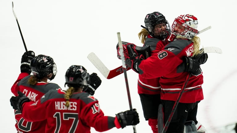 Ottawa goaltender Emerance Maschmeyer (38) celebrates the team's shootout win...