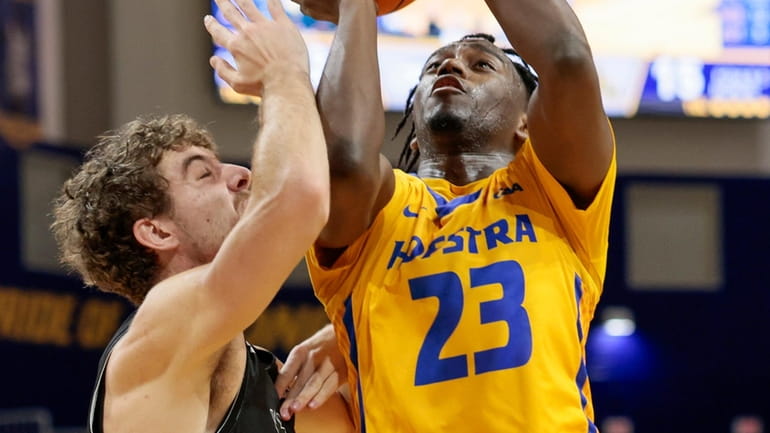 Hofstra Pride guard Tyler Thomas looks to shoot over William &...