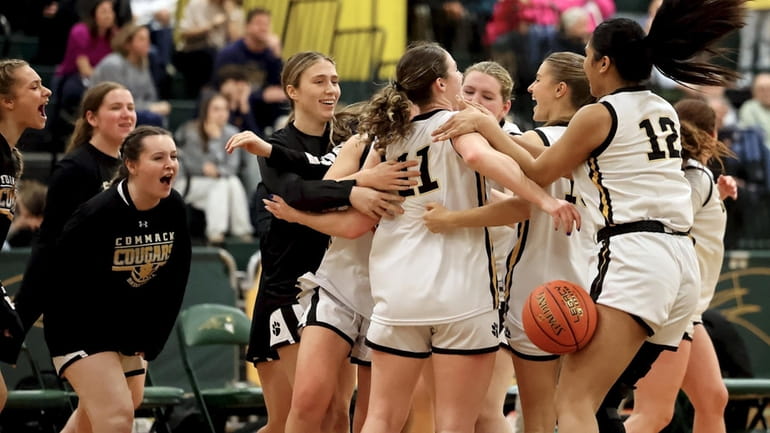 Commack players celebrate their victory over Northport in a Suffolk Class...