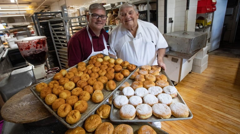 Karl Riesterer Jr. and Sr. with their sufganiyot at Riesterer’s...