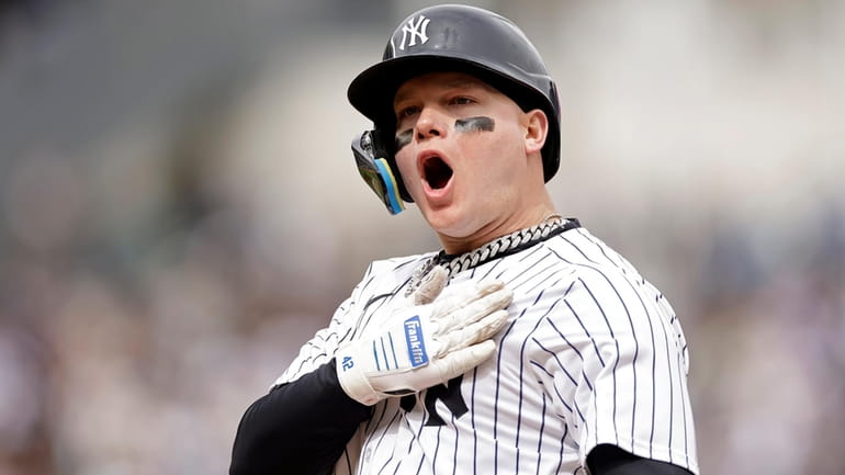 The Yankees' Alex Verdugo reacts after hitting a two run-scoring...