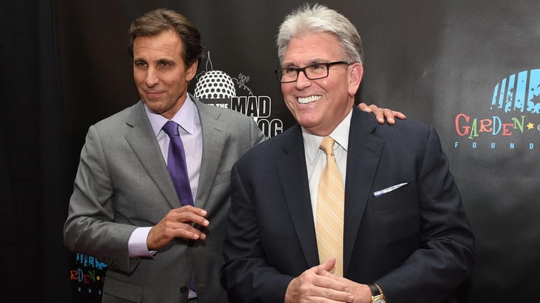 Chris "Mad Dog" Russo, left, and Mike Francesa walk the red...