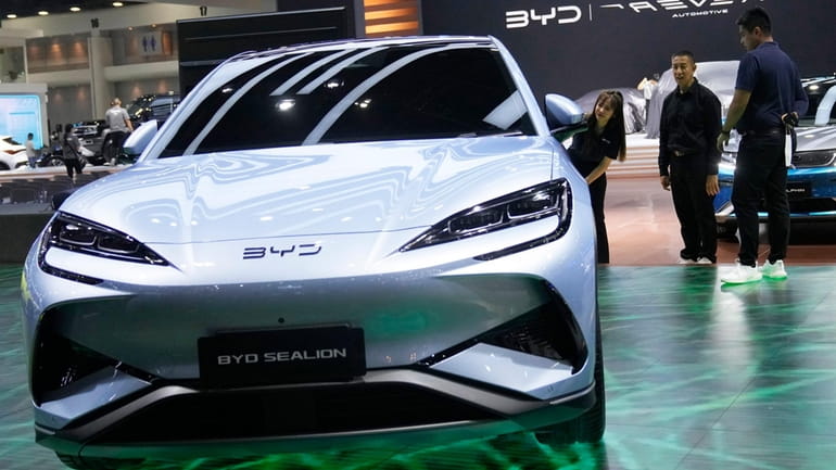 Visitors look at BYD's electric vehicle "Sealion" during the 45th...