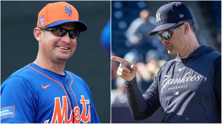 Mets manager Carlos Mendoza and Yankees manager Aaron Boone during...