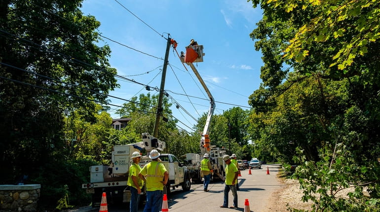 A utility crew restores power to angry residents on Spring...
