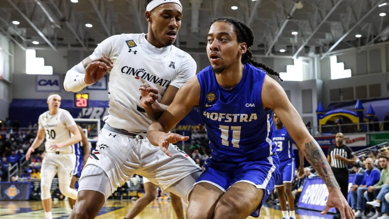 Jaquan Carlos of Hofstra looks to pass during the NIT...