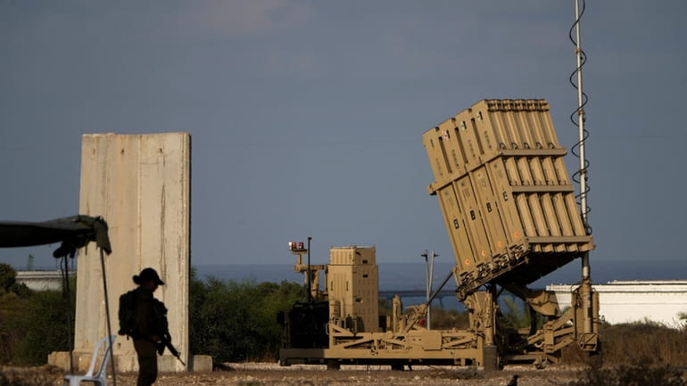 A battery of Israel's Iron Dome defense missile system, deployed...
