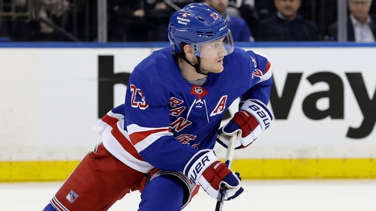 Adam Fox of the New York Rangers skates against the...