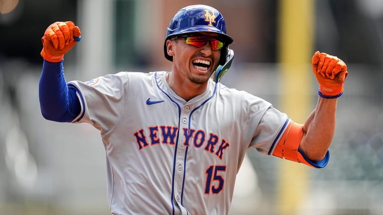Mets outfielder Tyrone Taylor celebrates a ninth-inning grand slam against...