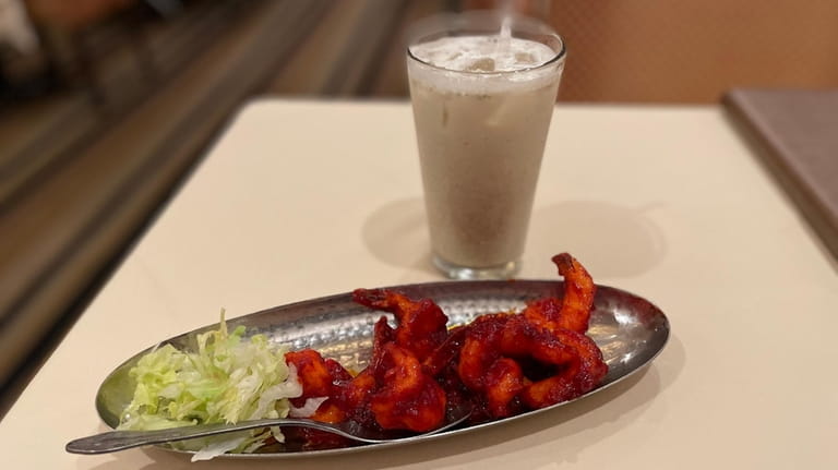 The non-alcoholic salted lassi with barbecued shrimp at Akbar in...