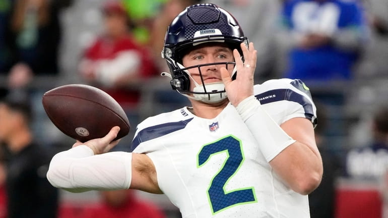 Drew Lock warms up before the Seahawks faced the Arizona Cardinals last...