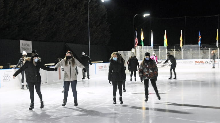 People ice skate at Bay Street Theater in Sag Harbor.