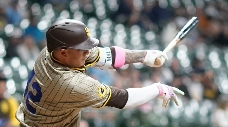 San Diego Padres' Manny Machado hits a single during the...