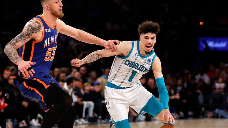 Charlotte Hornets guard LaMelo Ball (1) drives past New York...