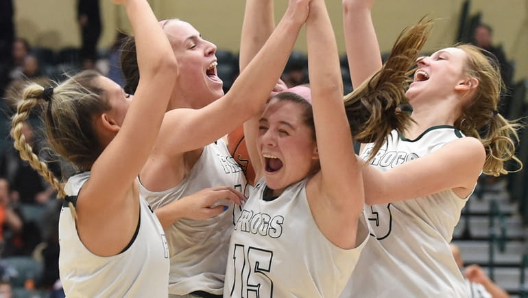 Caitlin Leary of Carle Place, second from left, celebrates with Paige...