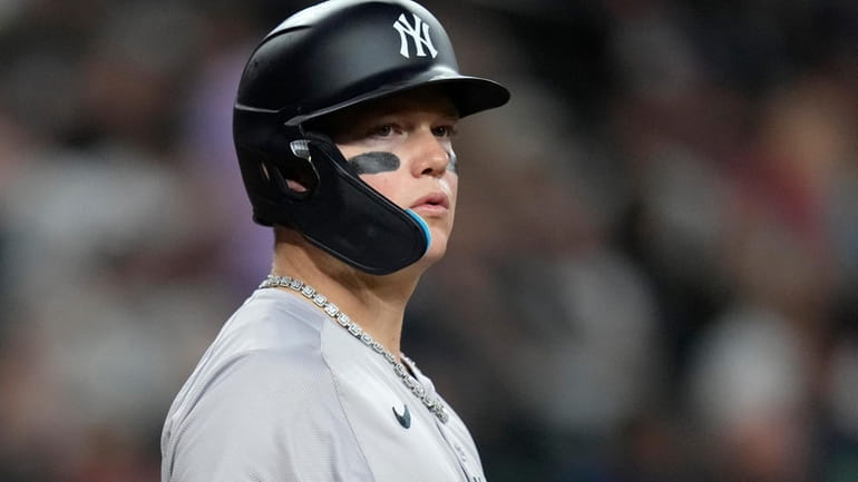 New York Yankees' Alex Verdugo pauses at home plate while...