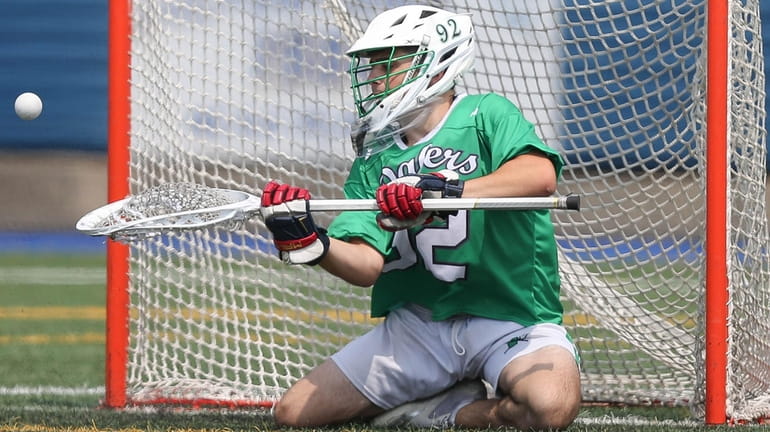 Farmingdale's Mike Ippoliti makes a save in the third quarter of...