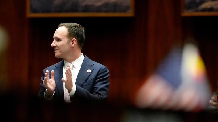 Arizona State Rep. Matt Gress, applauds on the House floor,...