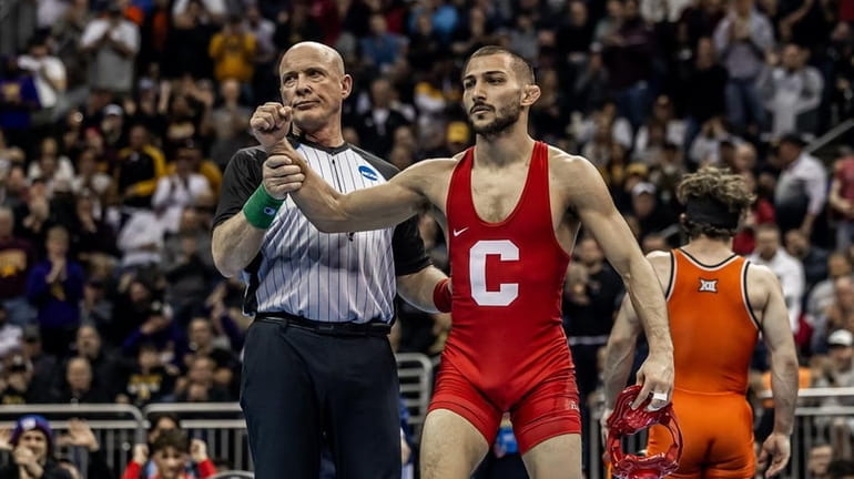 Vito Arujau of Cornell wins the 133-pound national championship at the...