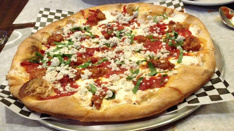 Hot cherry peppers and crumbled spicy sausage ignite the "flame"...